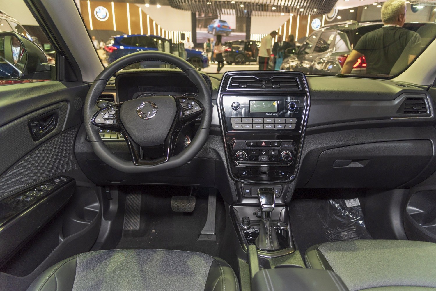 Dashboard and multifunction steering wheel with center console controls