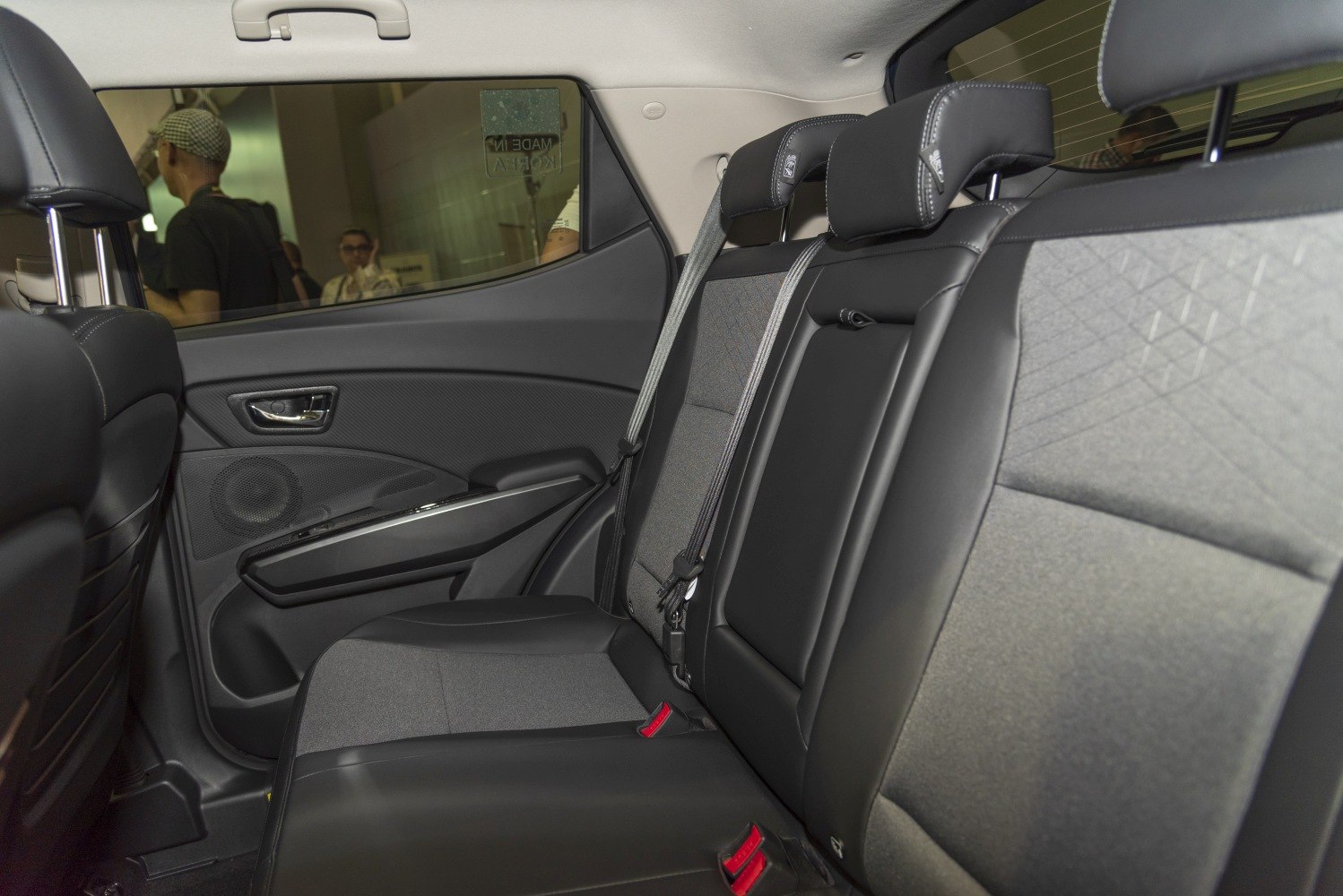 Rear seat interior with fabric-leather upholstery and safety seat belts