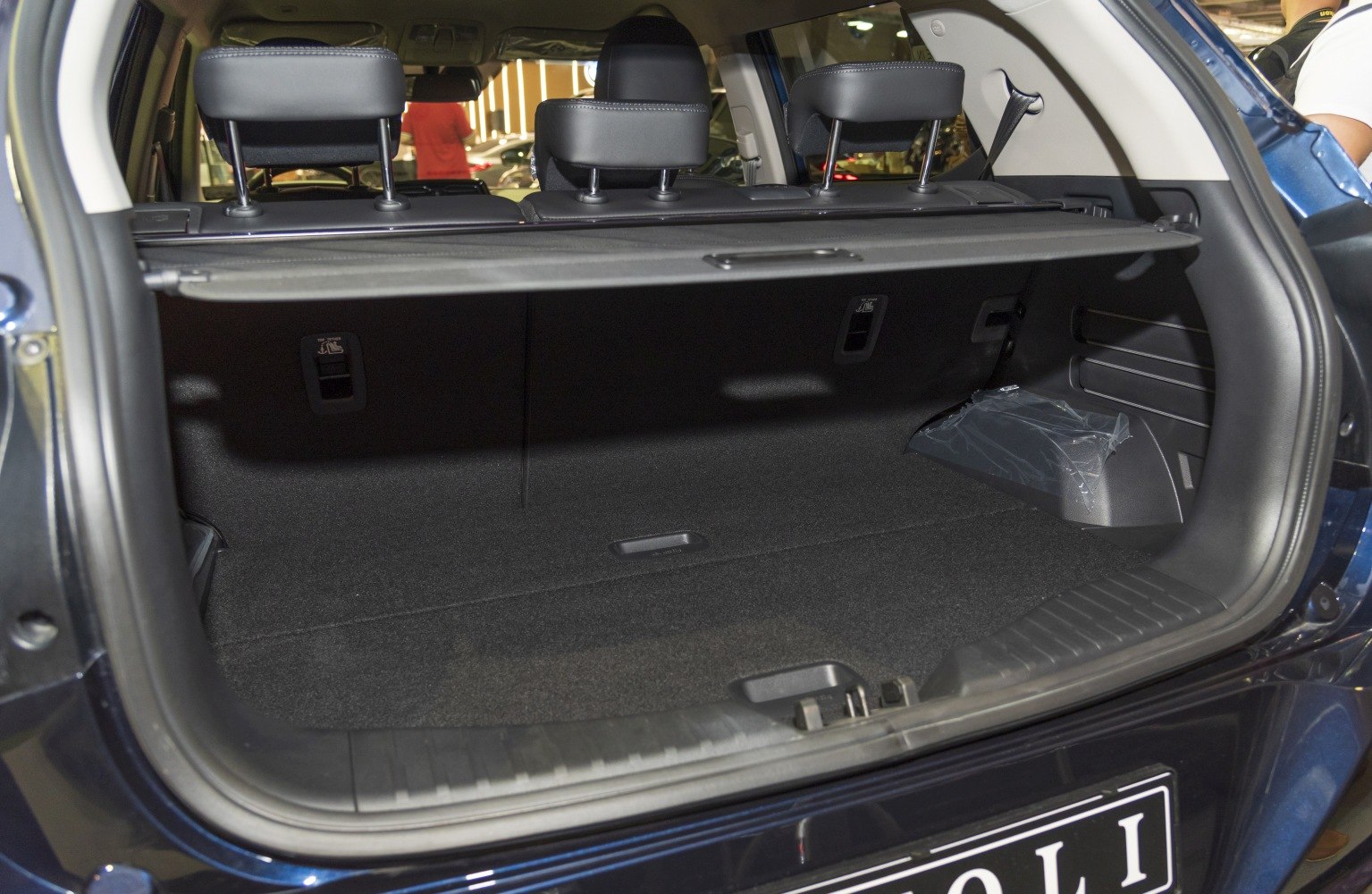Spacious rear cargo area with folded rear seats and retractable cargo cover