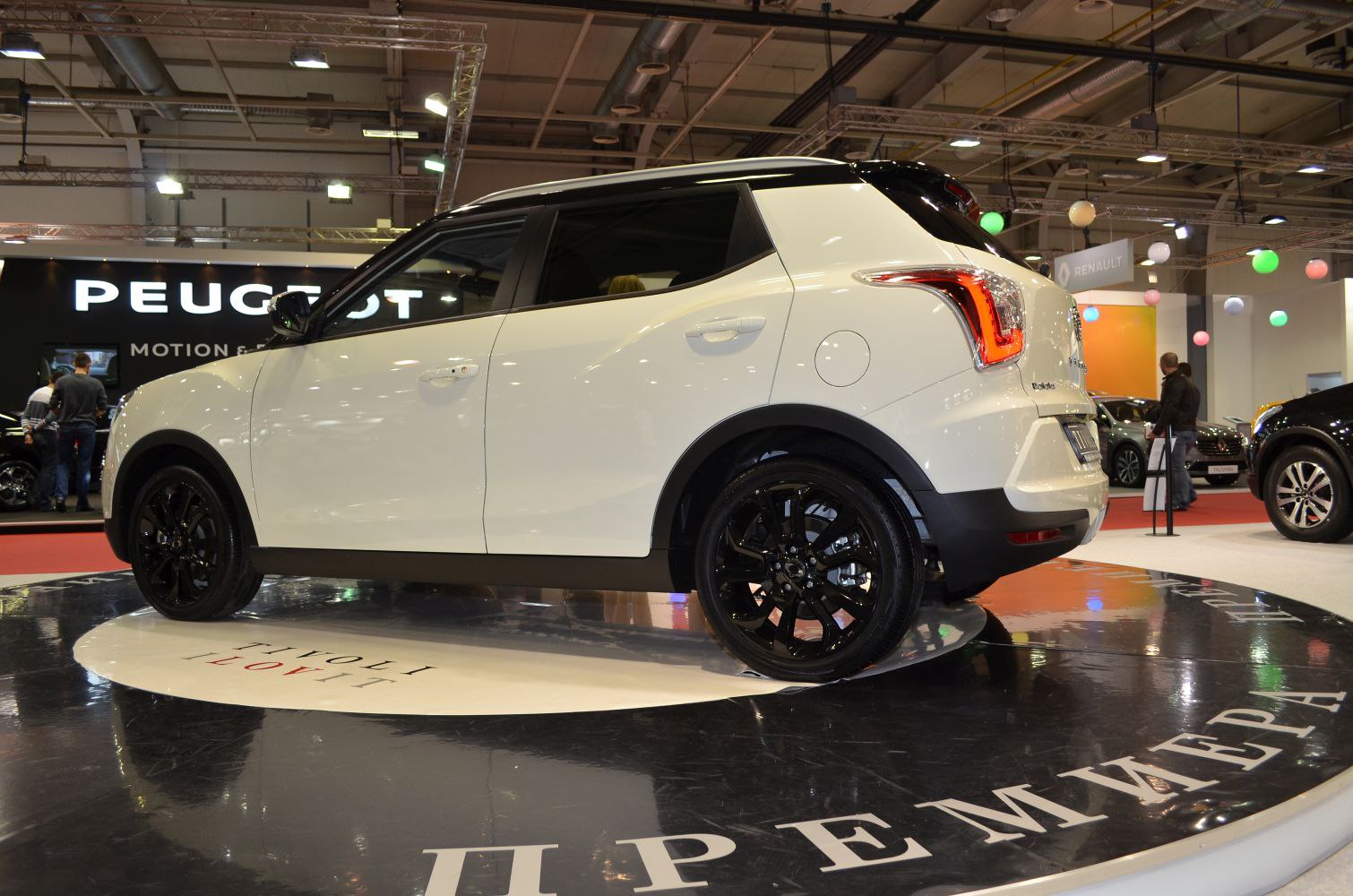 White compact crossover SUV with black roof and black alloy wheels