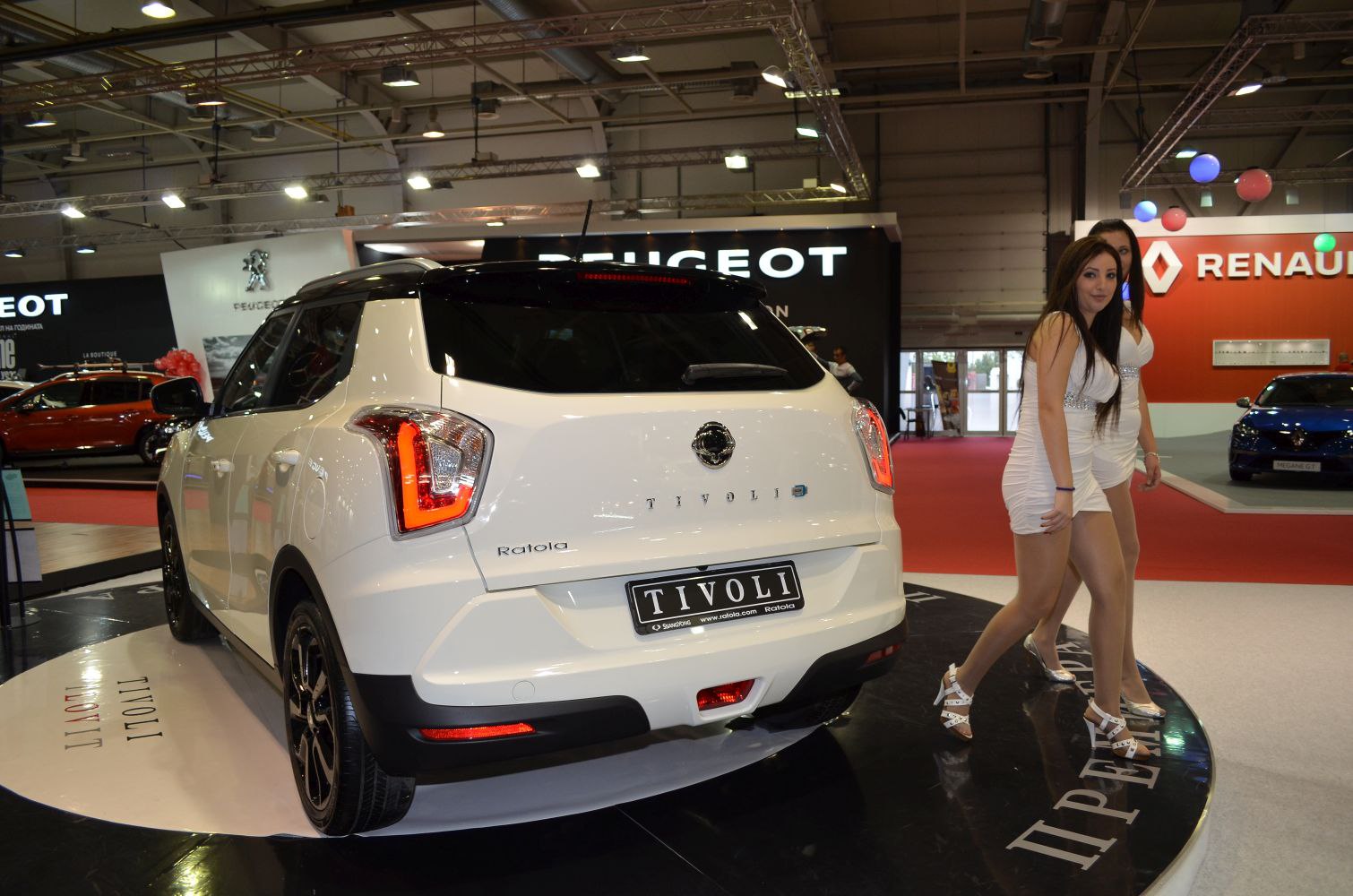 Rear view of white compact SUV with black roof and distinct taillights