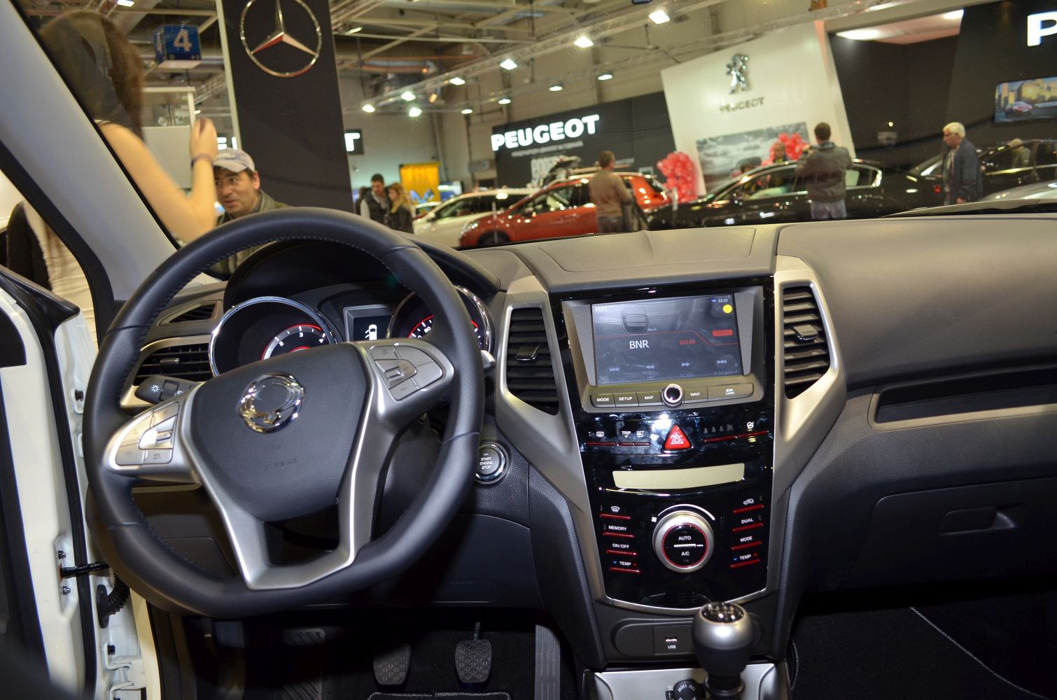 Dashboard and steering wheel with infotainment and climate controls