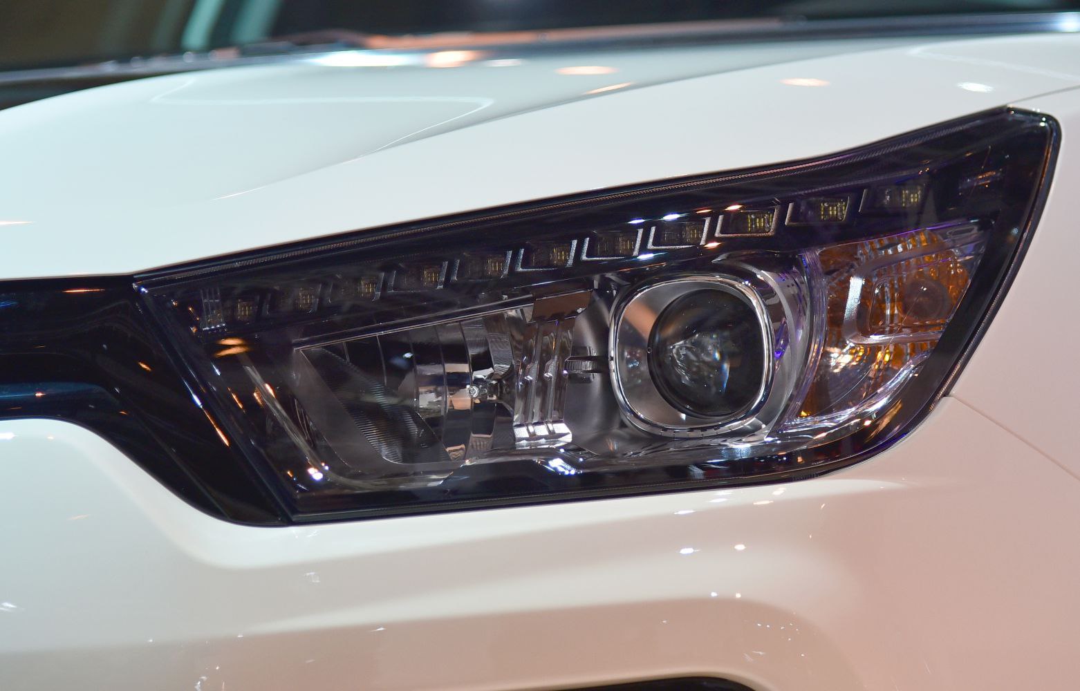 Close-up of modern car headlight with detailed lighting elements