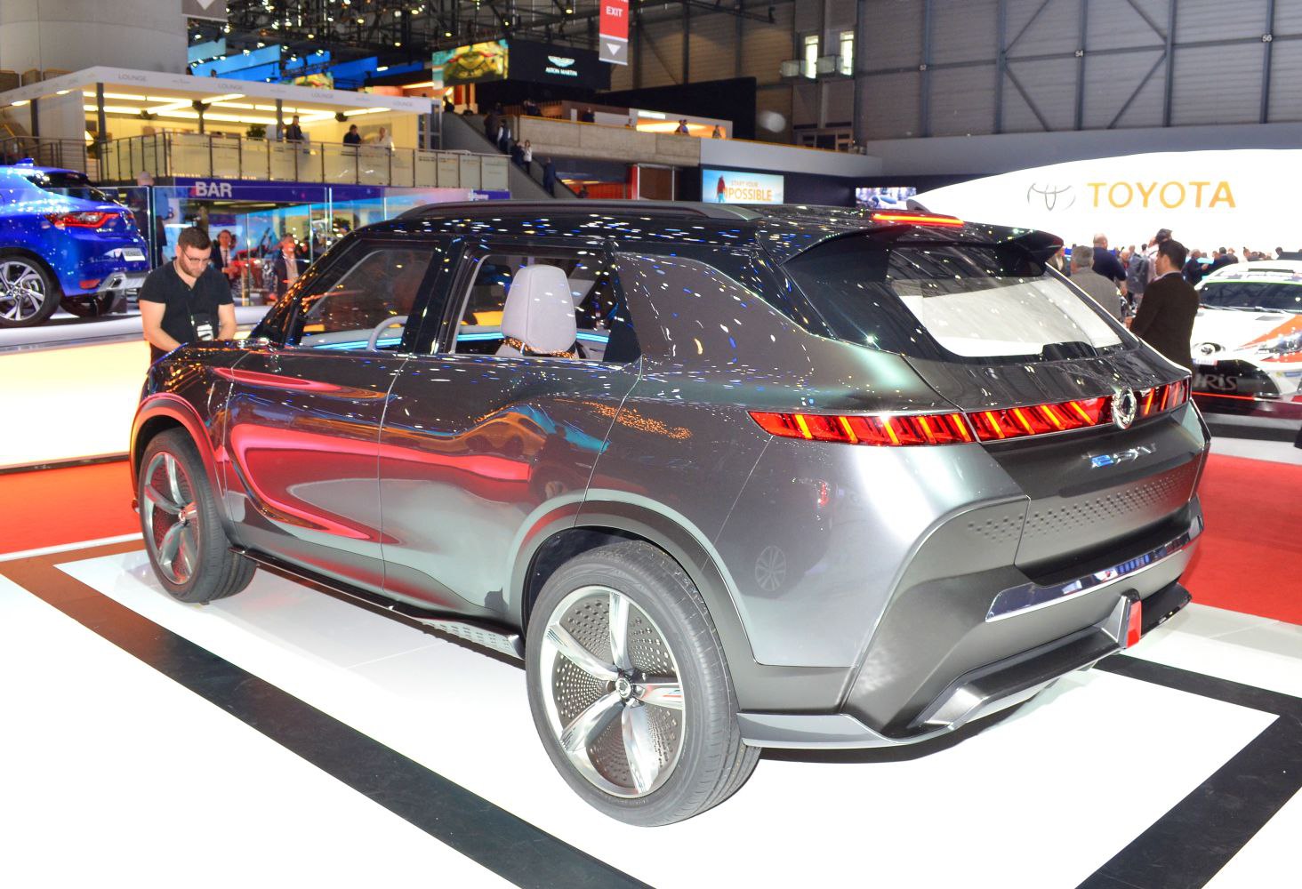 Rear three-quarter view with continuous LED taillight strip and smooth aerodynamic body.