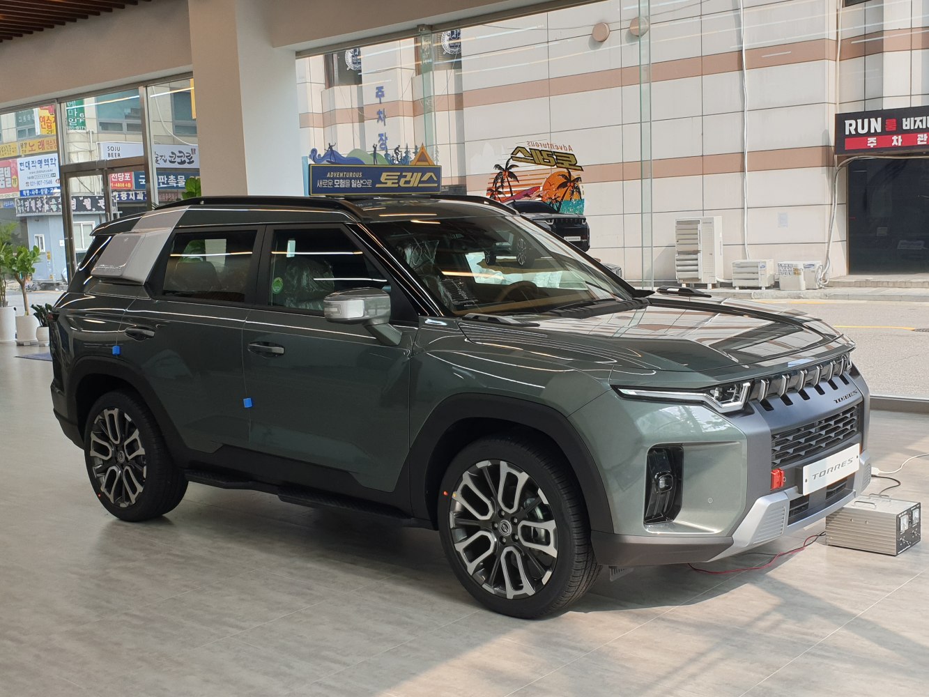 Front and side view of a modern SUV with distinctive alloy wheels