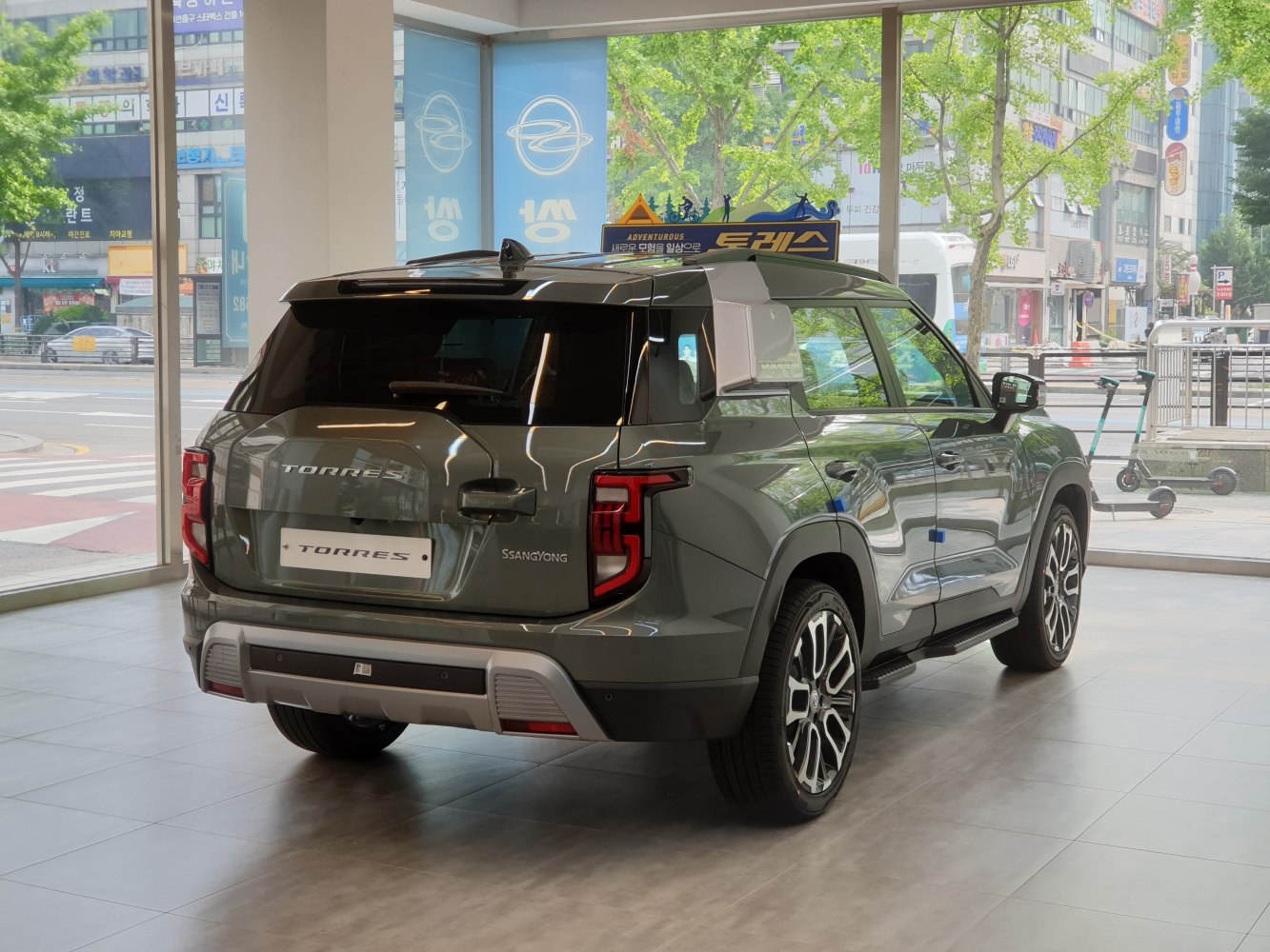 Rear and side exterior view with distinctive tail lights and alloy wheels