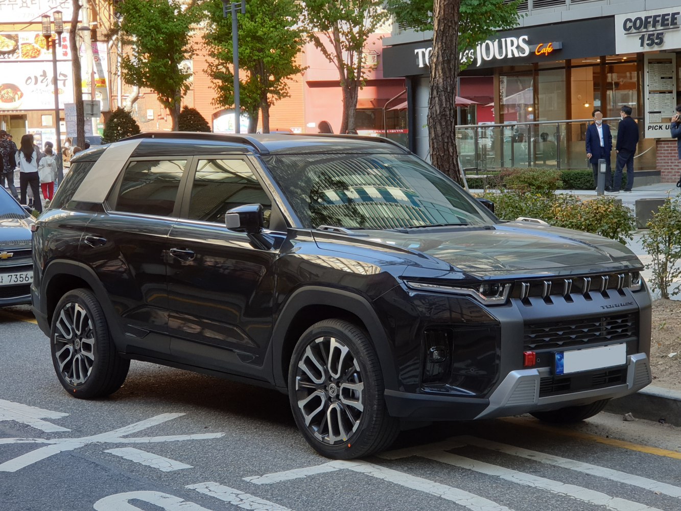 SUV front side view with bold grille and alloy wheels