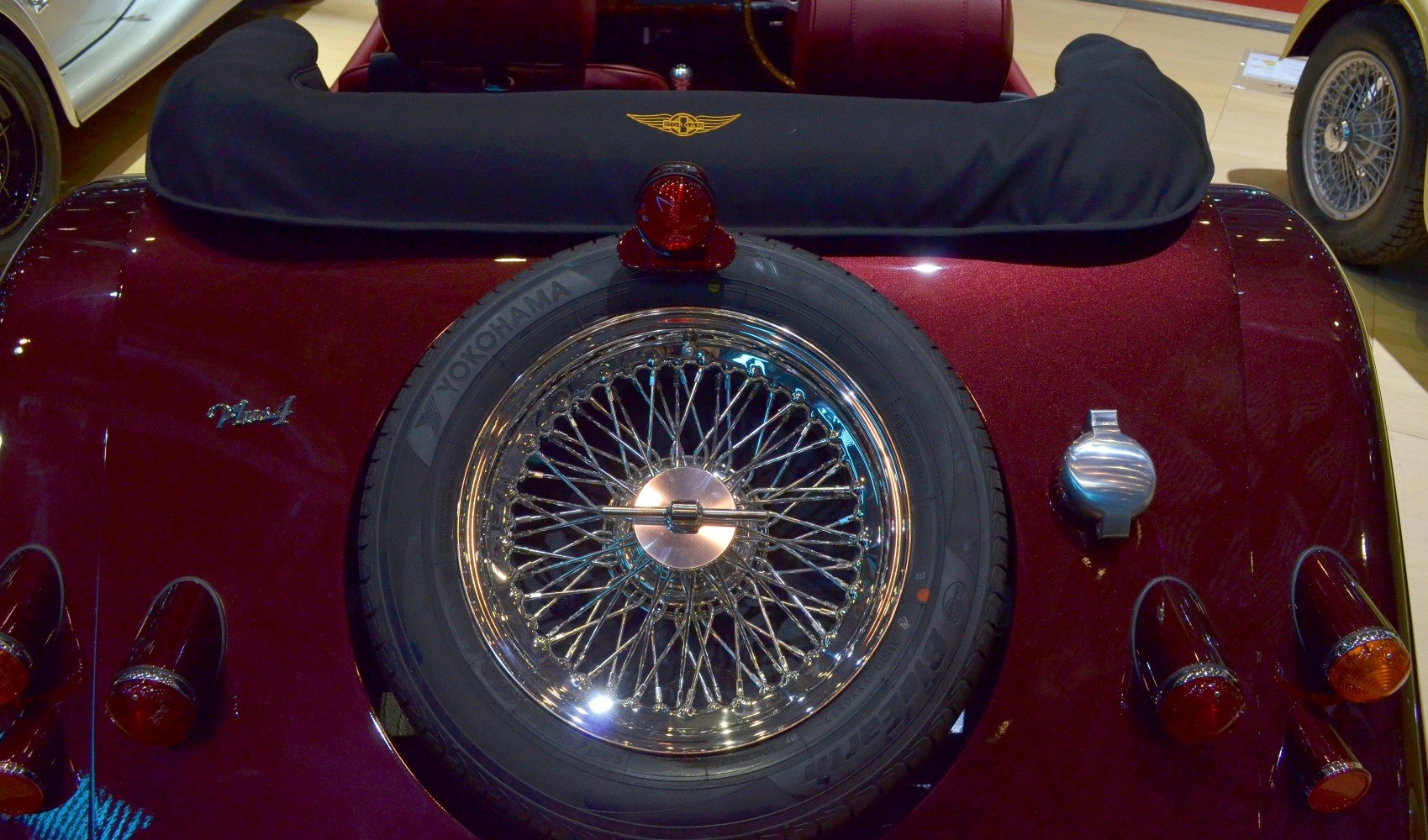 Rear with spare wheel, vintage taillights, and fuel cap