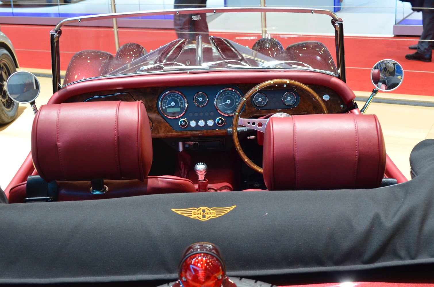 Wooden steering wheel and classic dashboard with leather seats