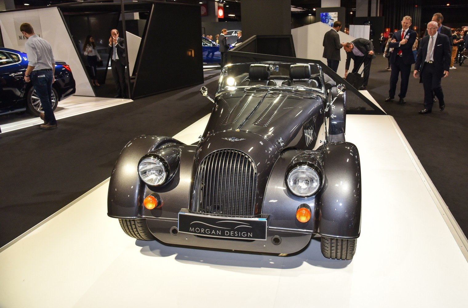 Classic retro roadster front view with exposed wheel arches and vintage styling