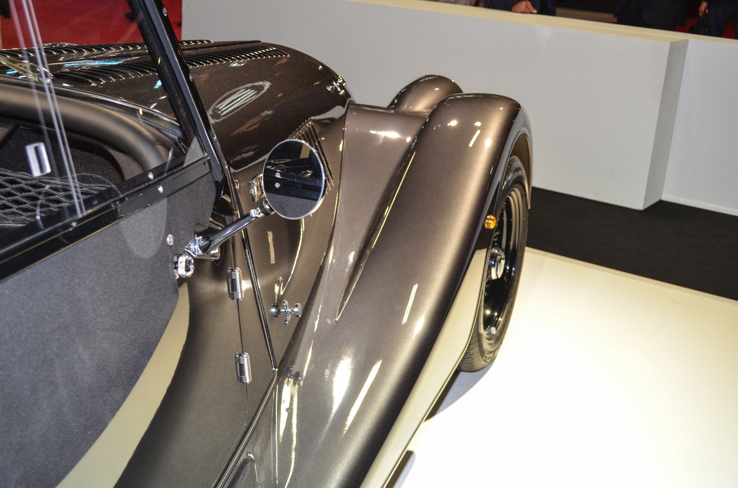 Close-up of vintage car wing and side mirror with wheel