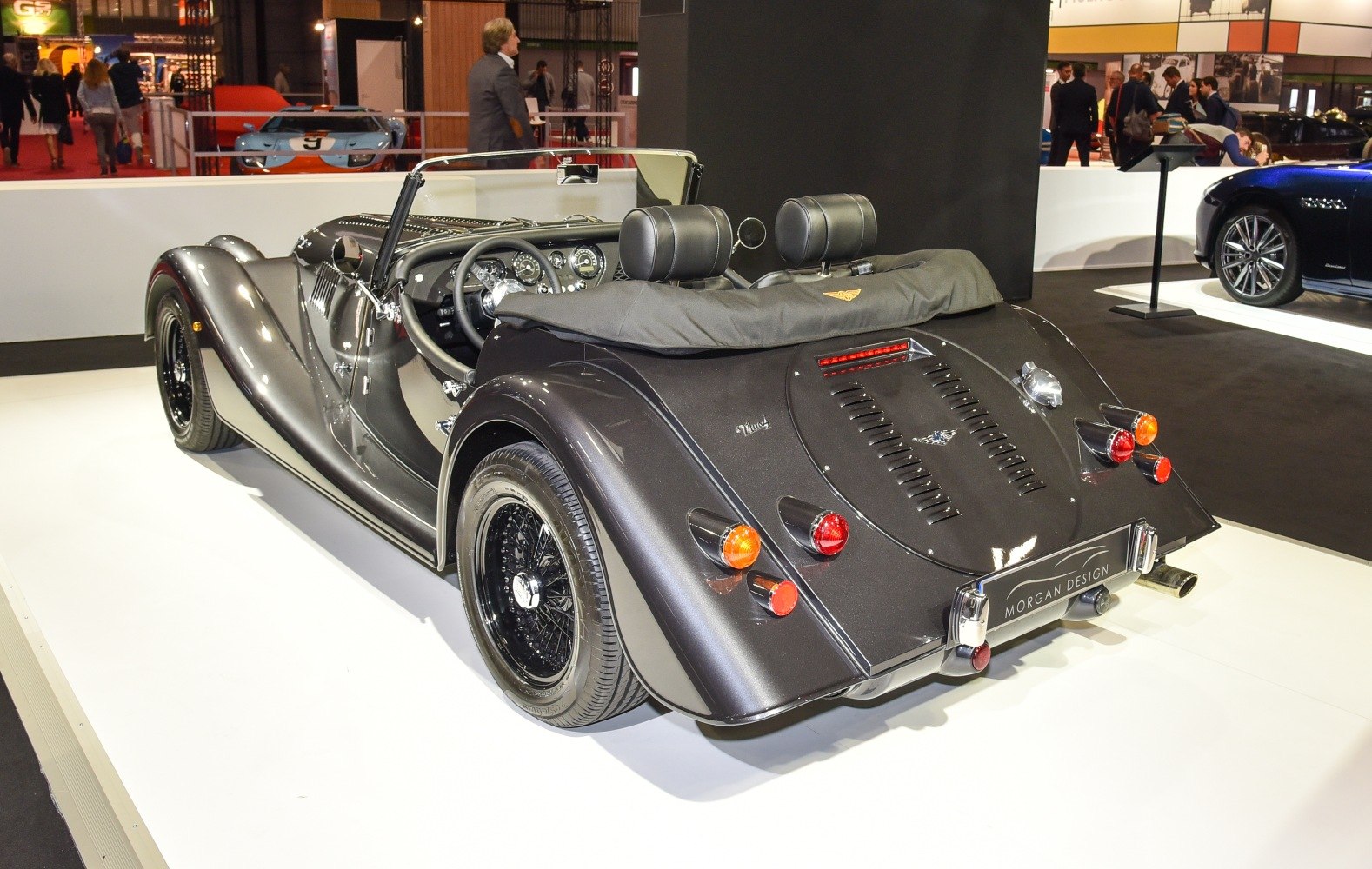 Rear and interior of classic open-top roadster with vintage design elements