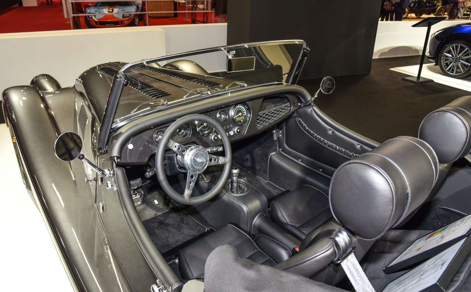 Black leather interior with classic dashboard and manual gear shift