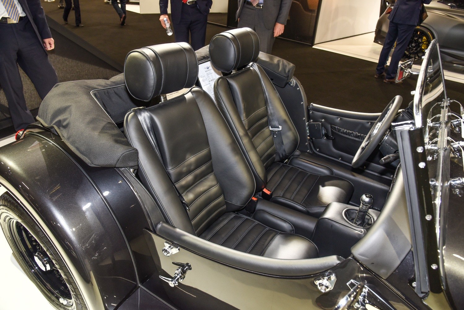 Black leather seats with classic roadster open cabin layout