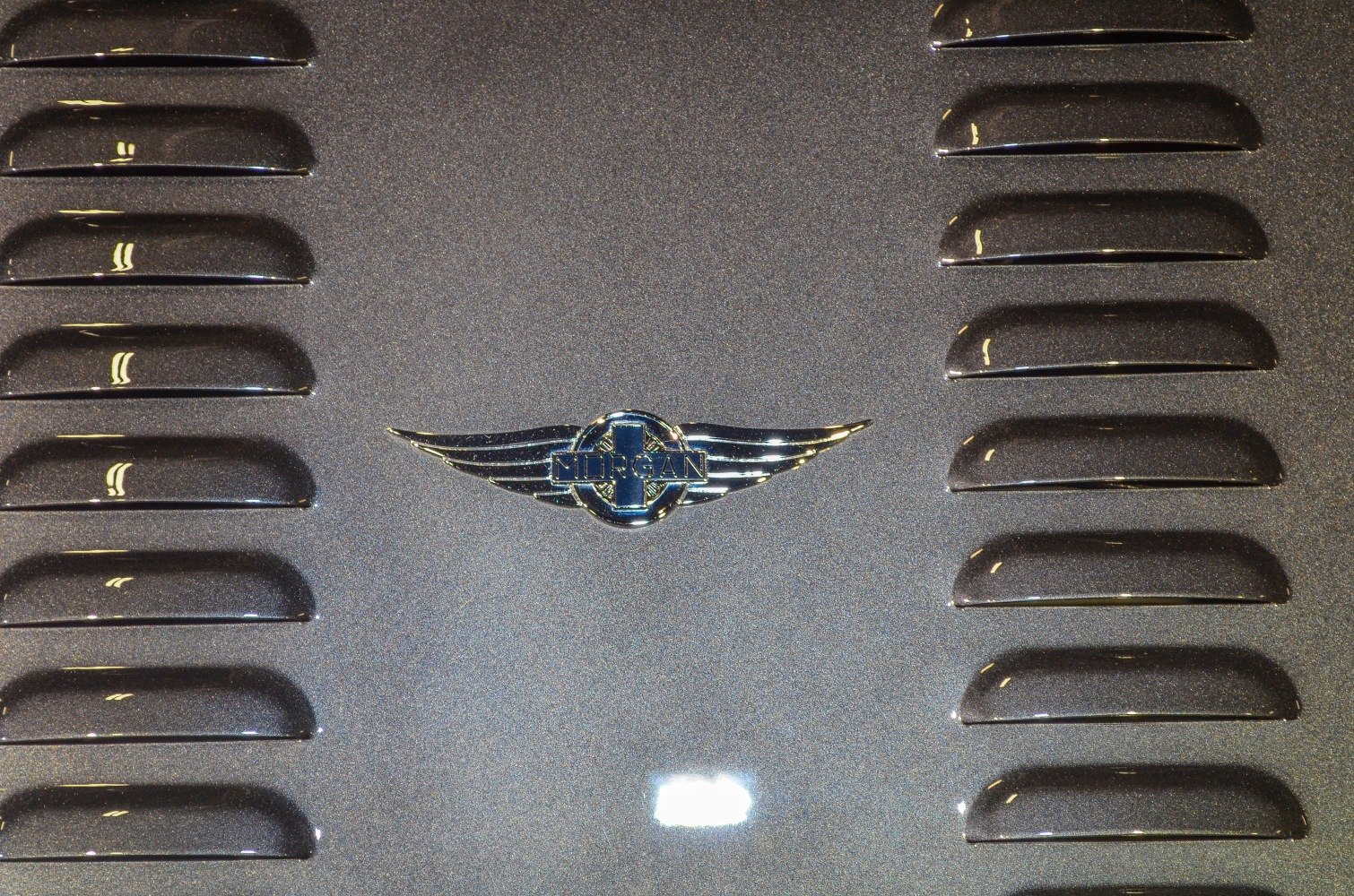 Morgan Plus 4 hood with dual symmetrical vent grilles and central winged emblem