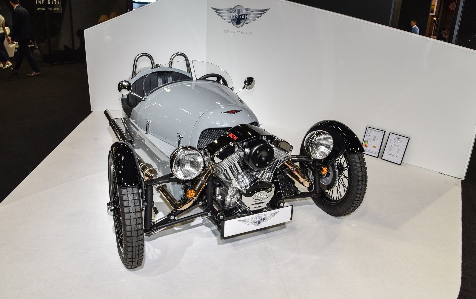 Retro three-wheel vehicle with exposed V-twin engine and black fenders
