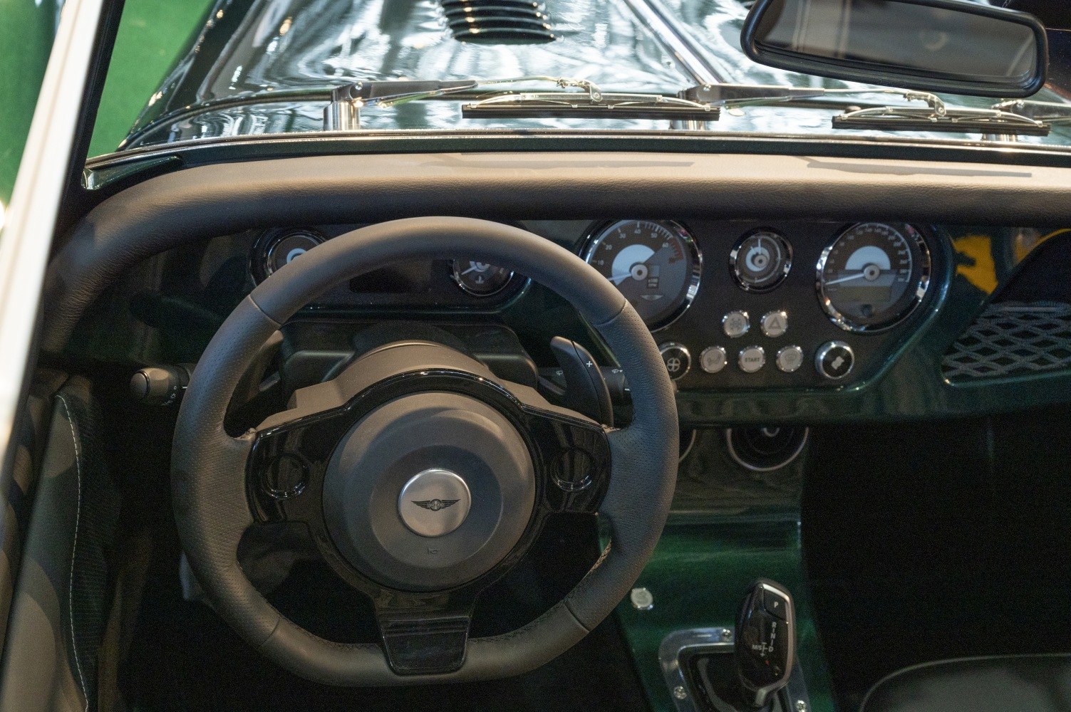 Classic dashboard and steering wheel with gauges and controls