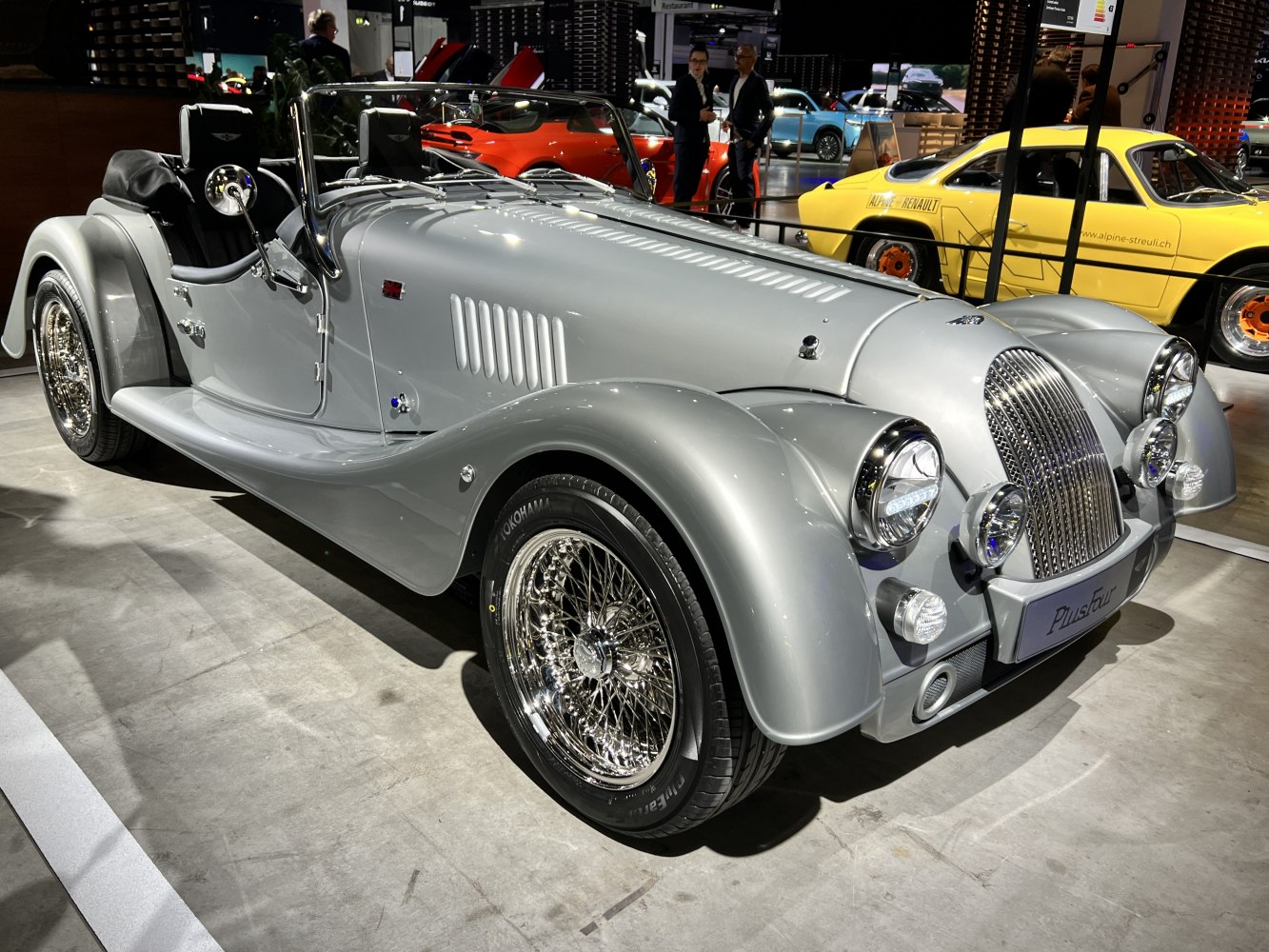Classic styled convertible roadster with wire-spoke wheels and vintage headlights