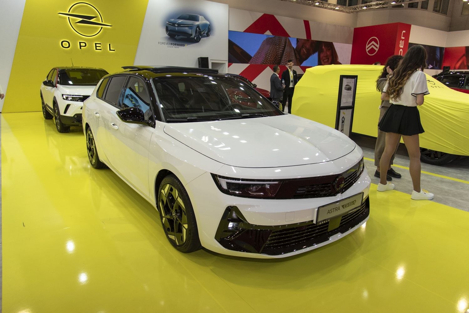 Sleek hatchback front and side view with black roof and sporty design