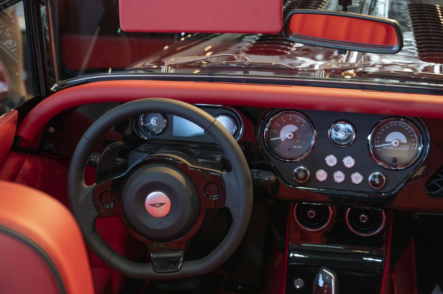 Classic-styled dashboard and leather steering wheel with gauges and controls