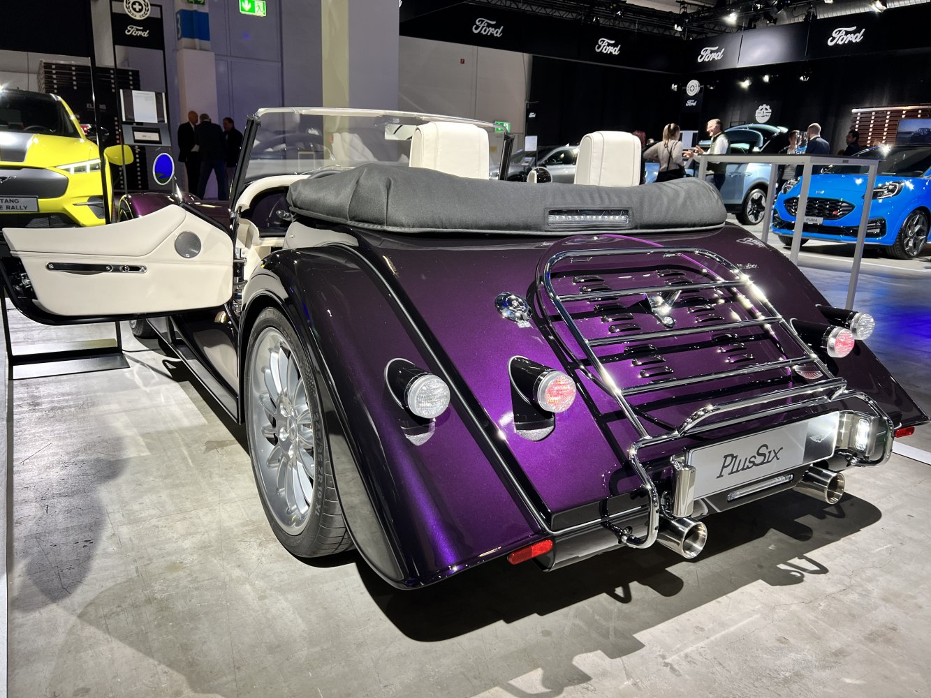 Convertible rear with luggage rack and dual exhaust, open door