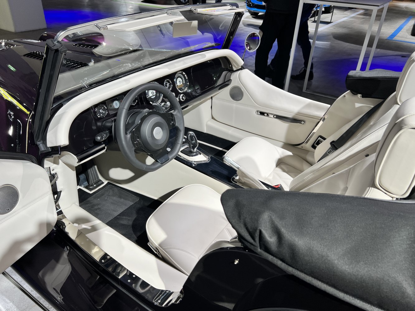 Luxury white leather interior with modern dashboard and open convertible design