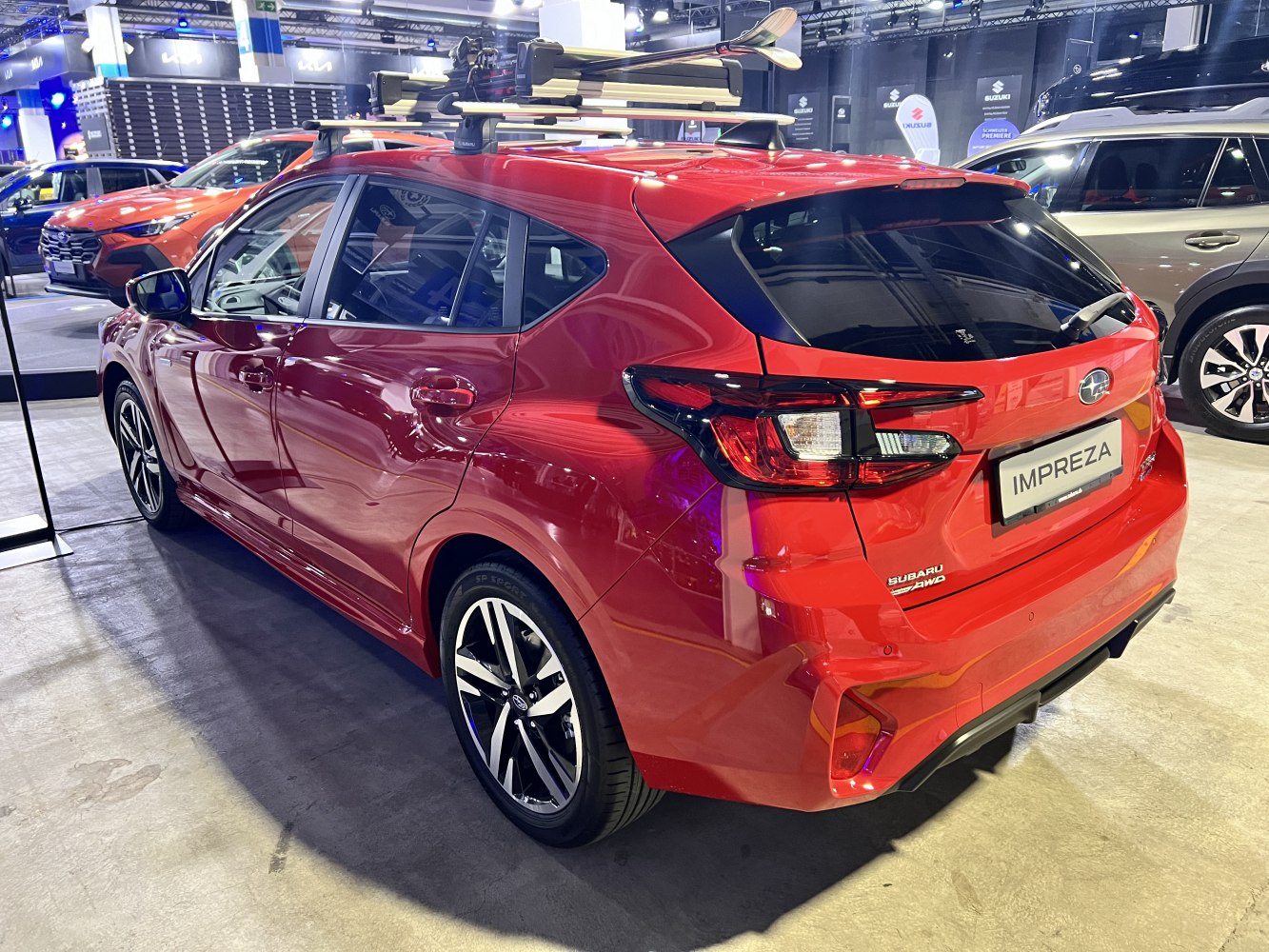Rear side view of a hatchback with a roof rack and sporty taillights