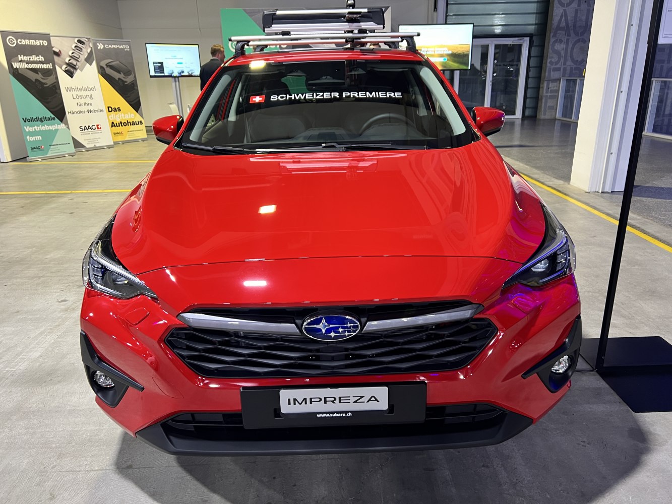 Front grille and headlights of a modern hatchback with roof rack