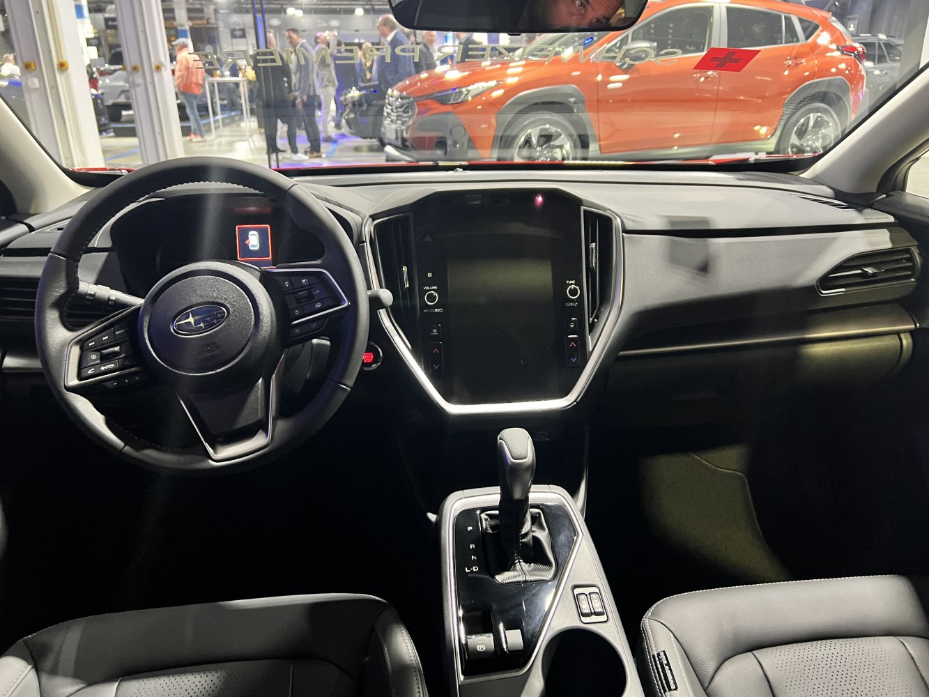 Steering wheel and center console with touchscreen and gear shifter