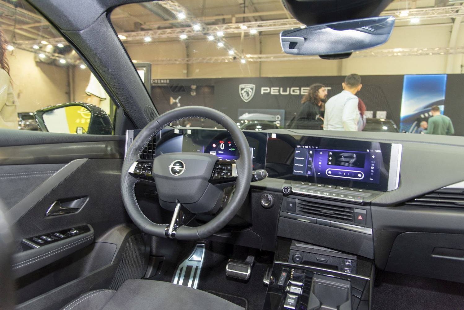 Digital dashboard and modern steering wheel in car interior