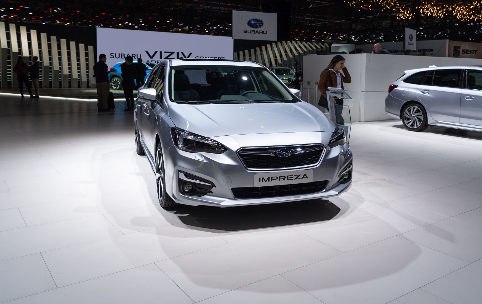 Front view of hatchback with distinctive headlights and grille