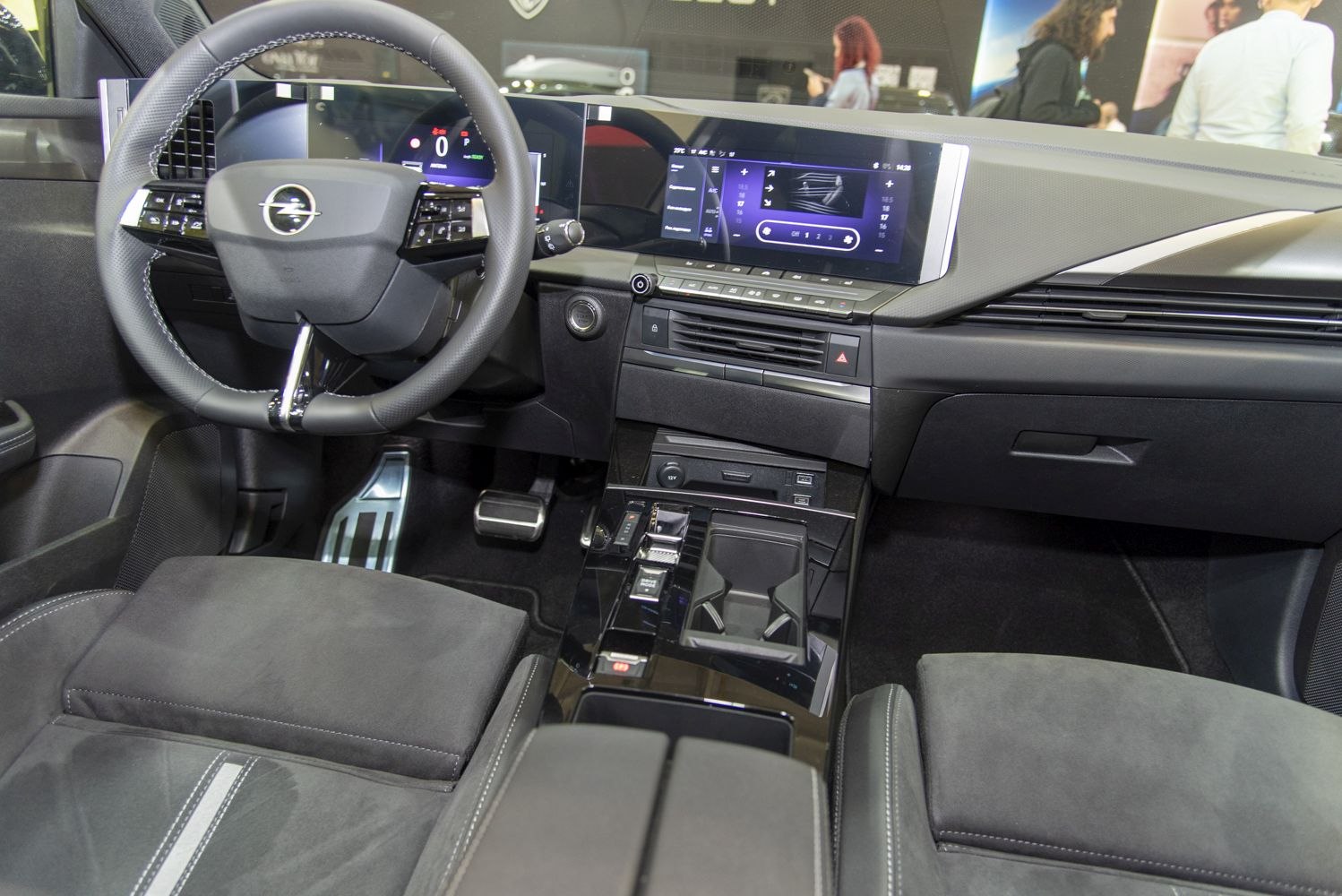 Modern car interior with digital dashboard and multifunctional steering wheel
