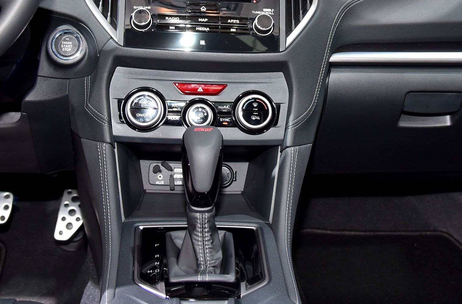 Gear shift lever and climate control panel with buttons and dials