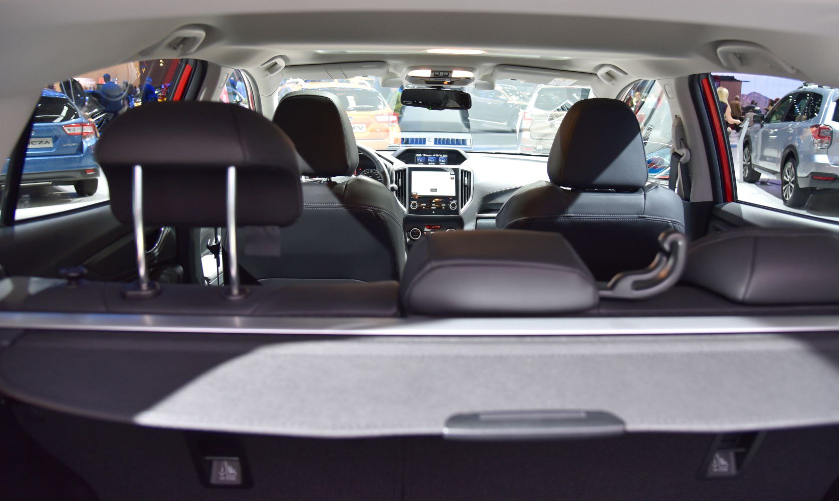 View of hatchback interior with dashboard and seating arrangement