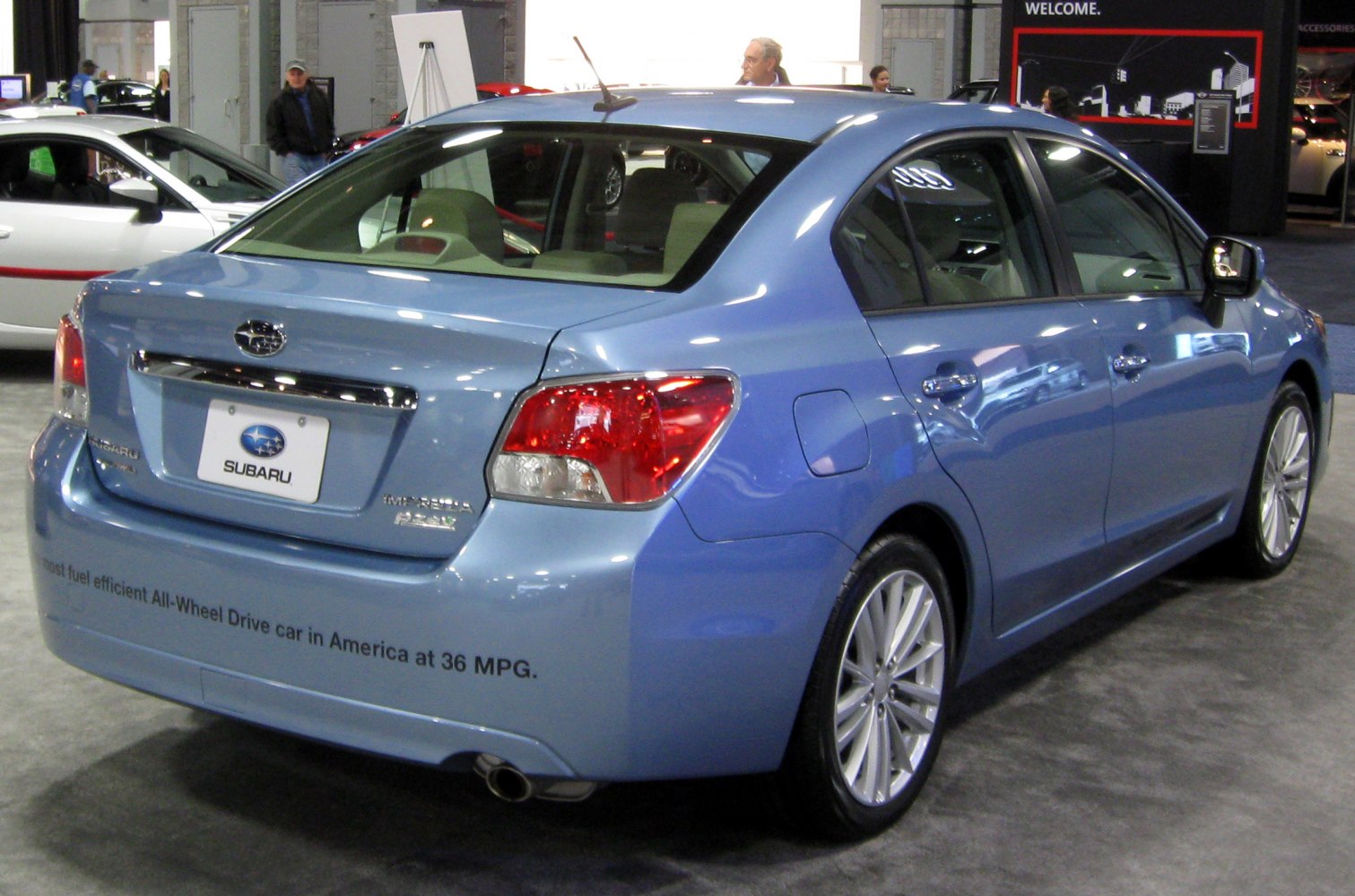 Rear and side profile with tail lights and alloy wheels