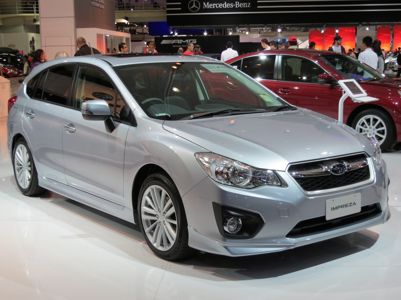 Silver compact hatchback with alloy wheels and modern front design