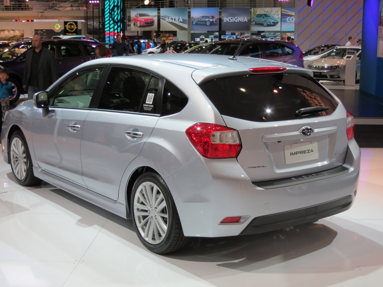 Silver hatchback with rear view and alloy wheels