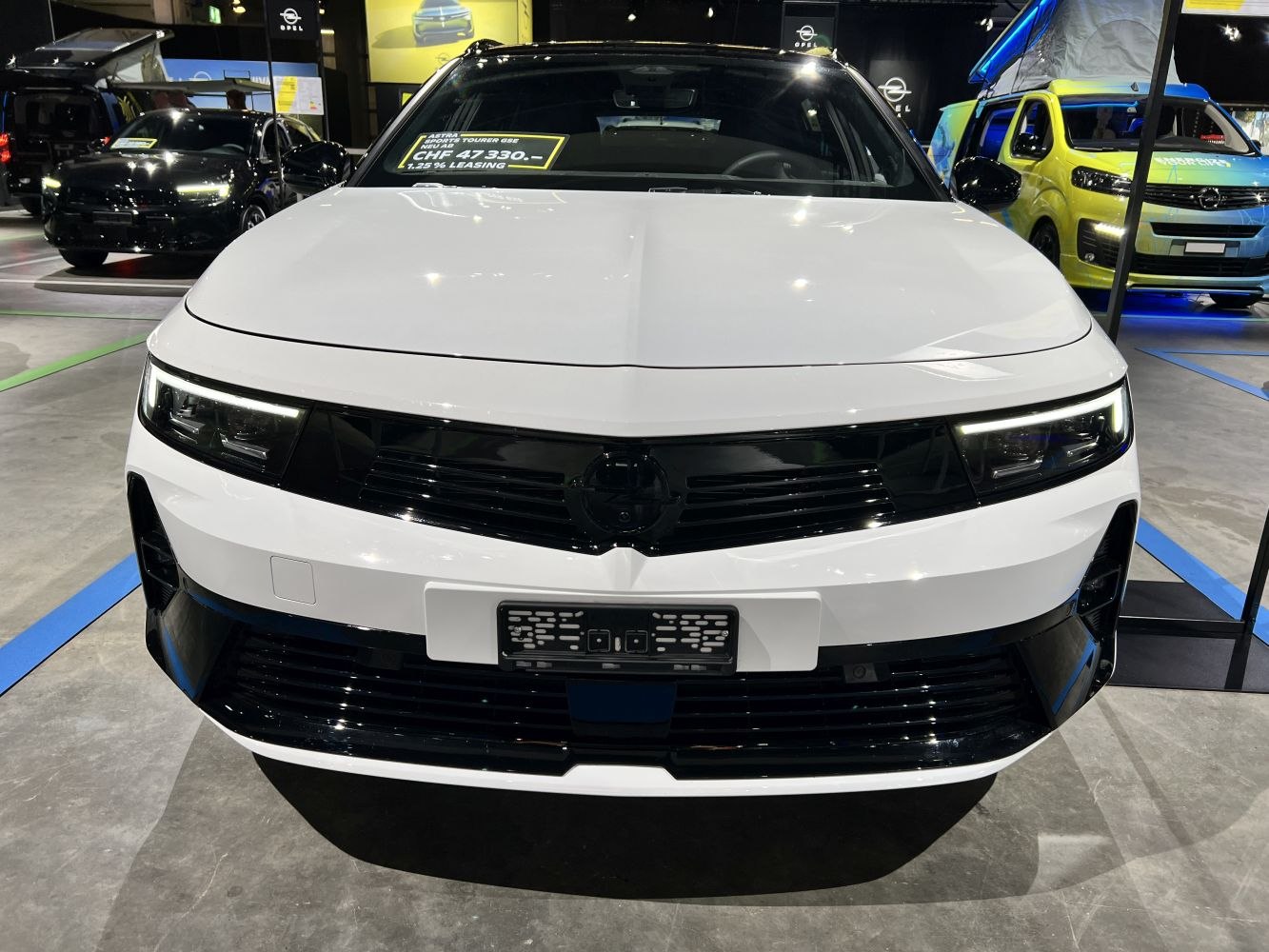 Front grille and LED headlights of modern vehicle.