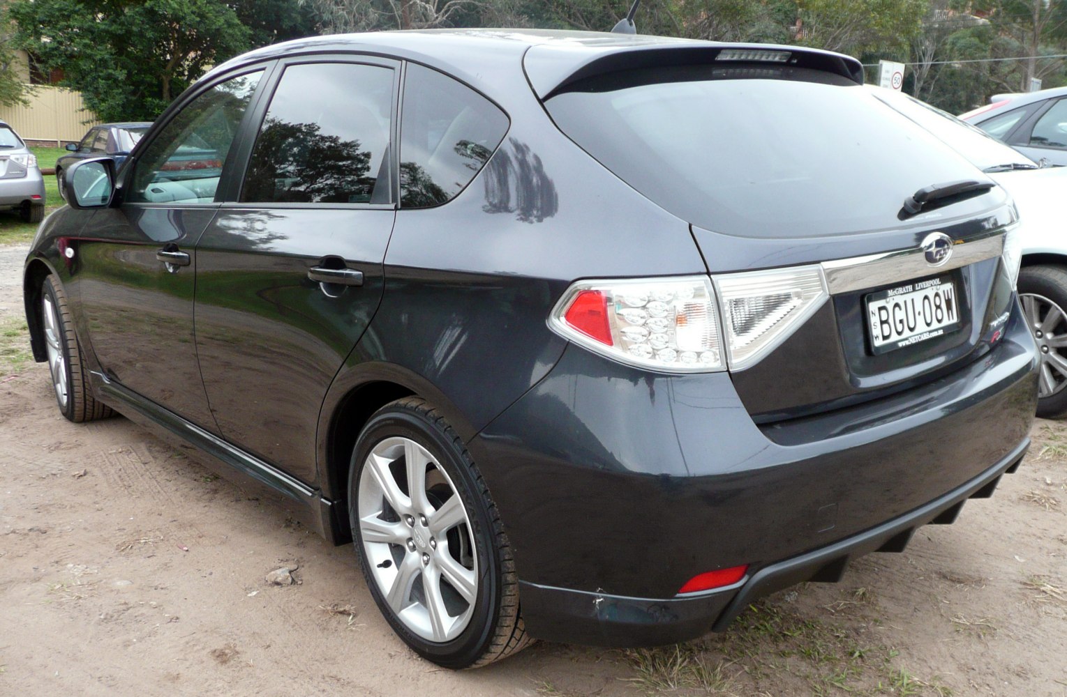 Rear view hatchback with alloy wheels and roof spoiler