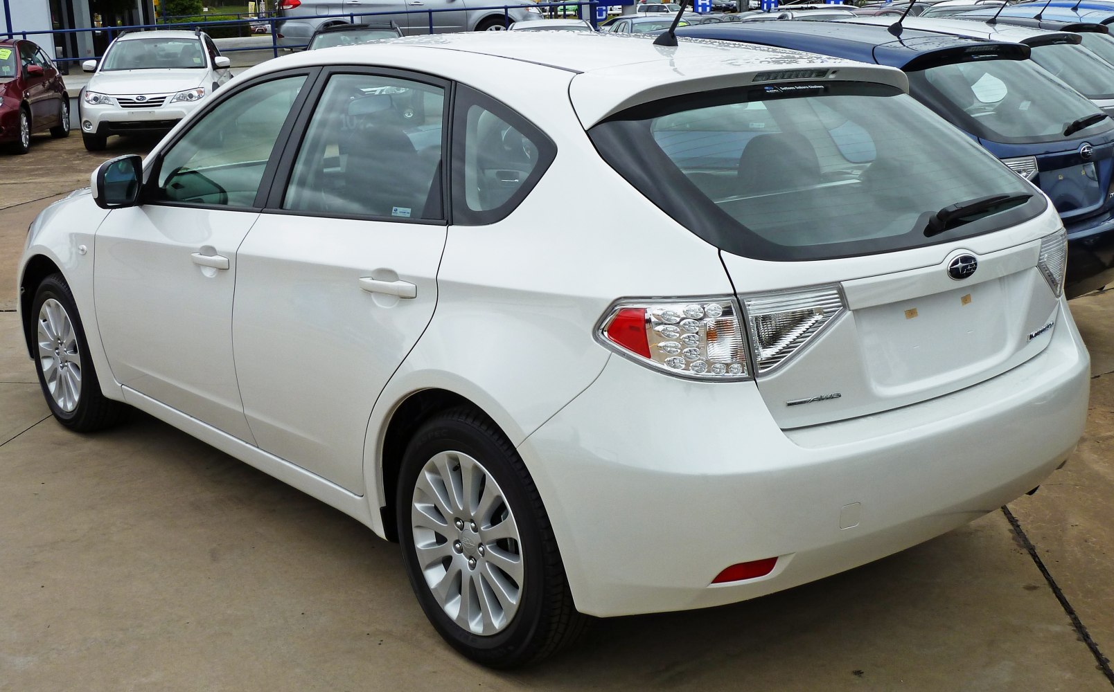Rear side view hatchback with taillights and rear spoiler