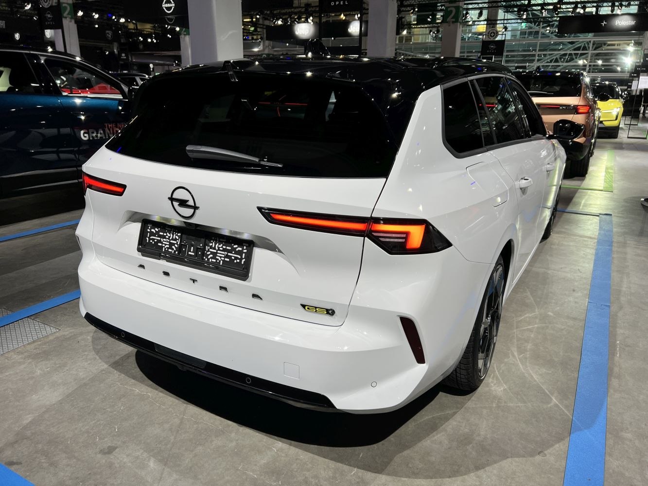 Rear view of white wagon with modern LED taillights and GS Line badge