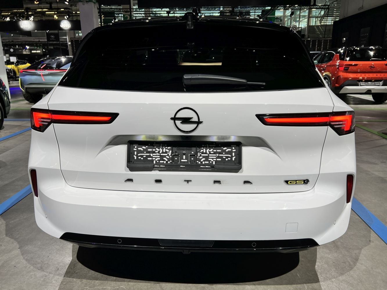 Sleek horizontal taillights and GS badge on rear of white station wagon