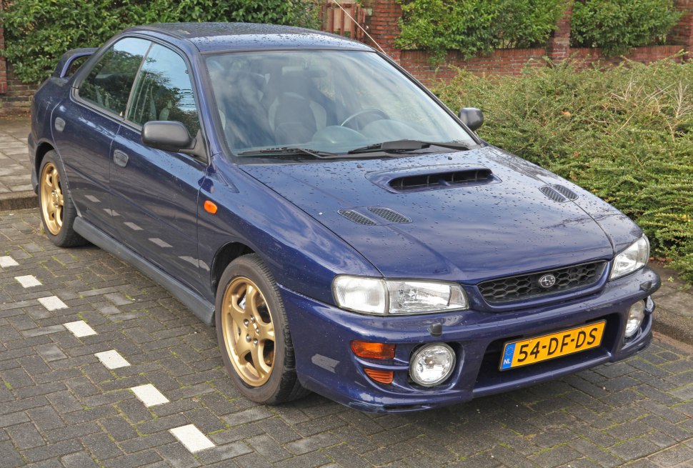 Hood scoop and gold alloy wheels on a sport sedan