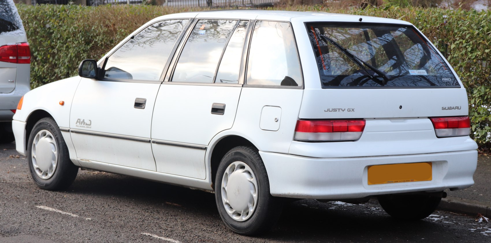 White hatchback with AWD badge and rear windshield wiper