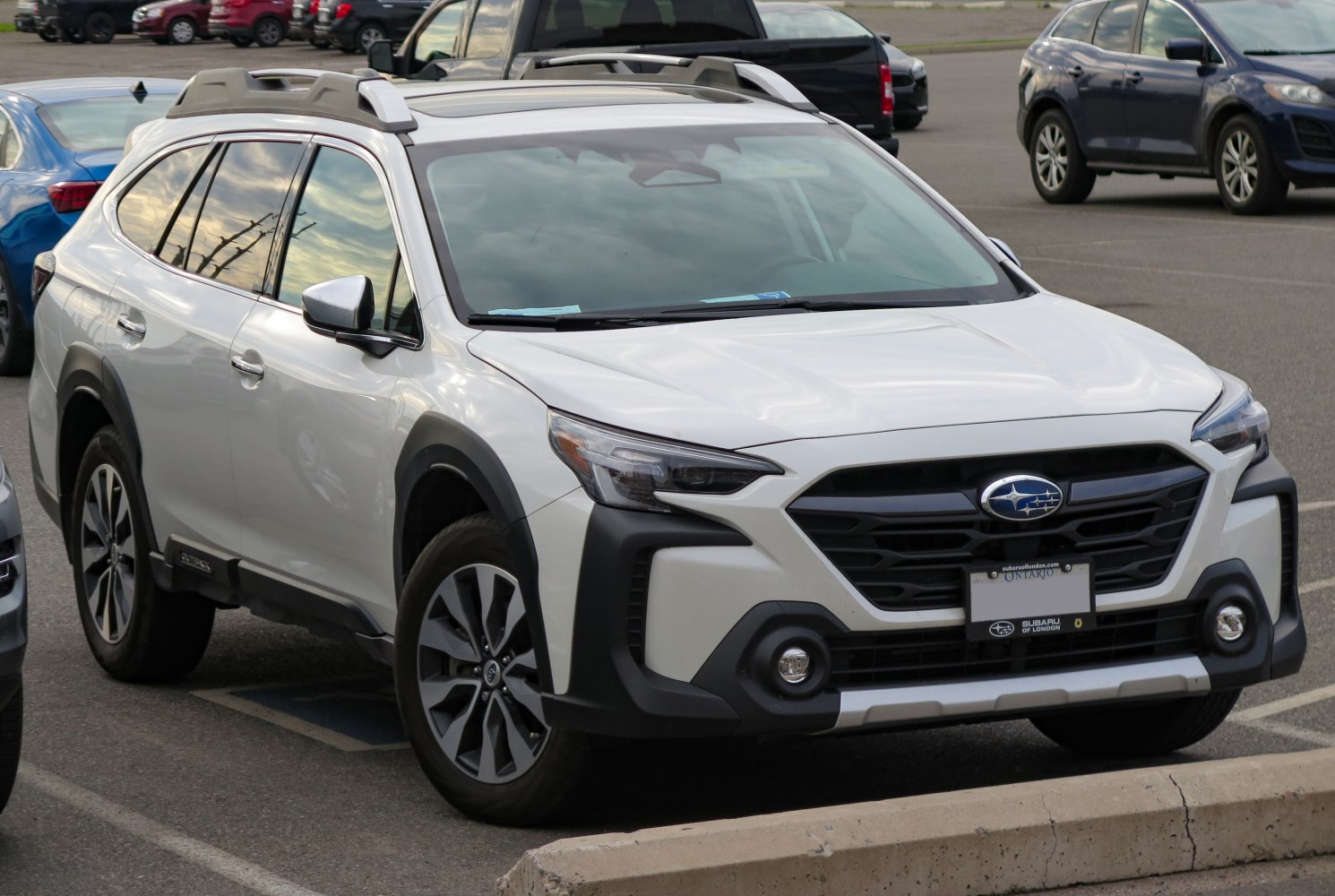 Front exterior and roof rails of a modern white SUV