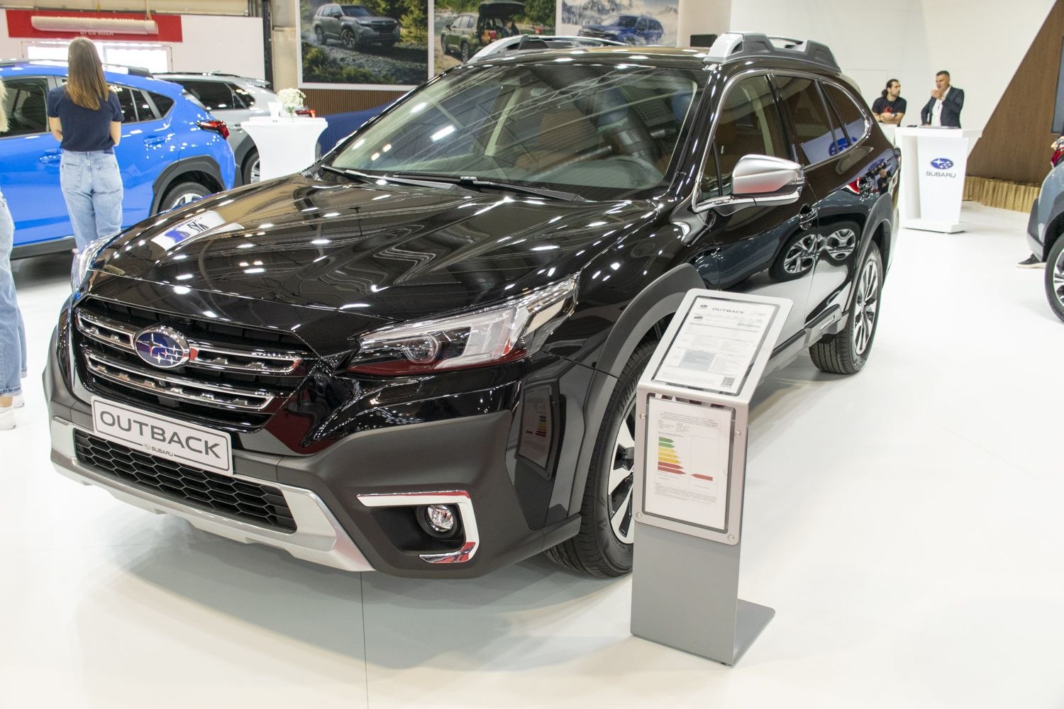 Front and side view with headlights and rugged body cladding
