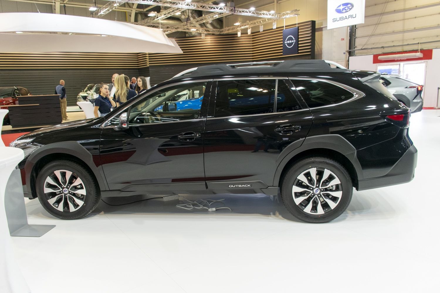 Side profile of black 2023 crossover SUV with alloy wheels