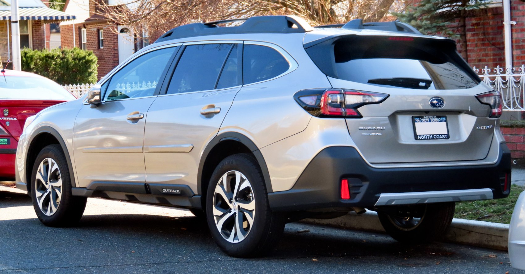 Rear and side view of a modern SUV with roof rails and alloy wheels