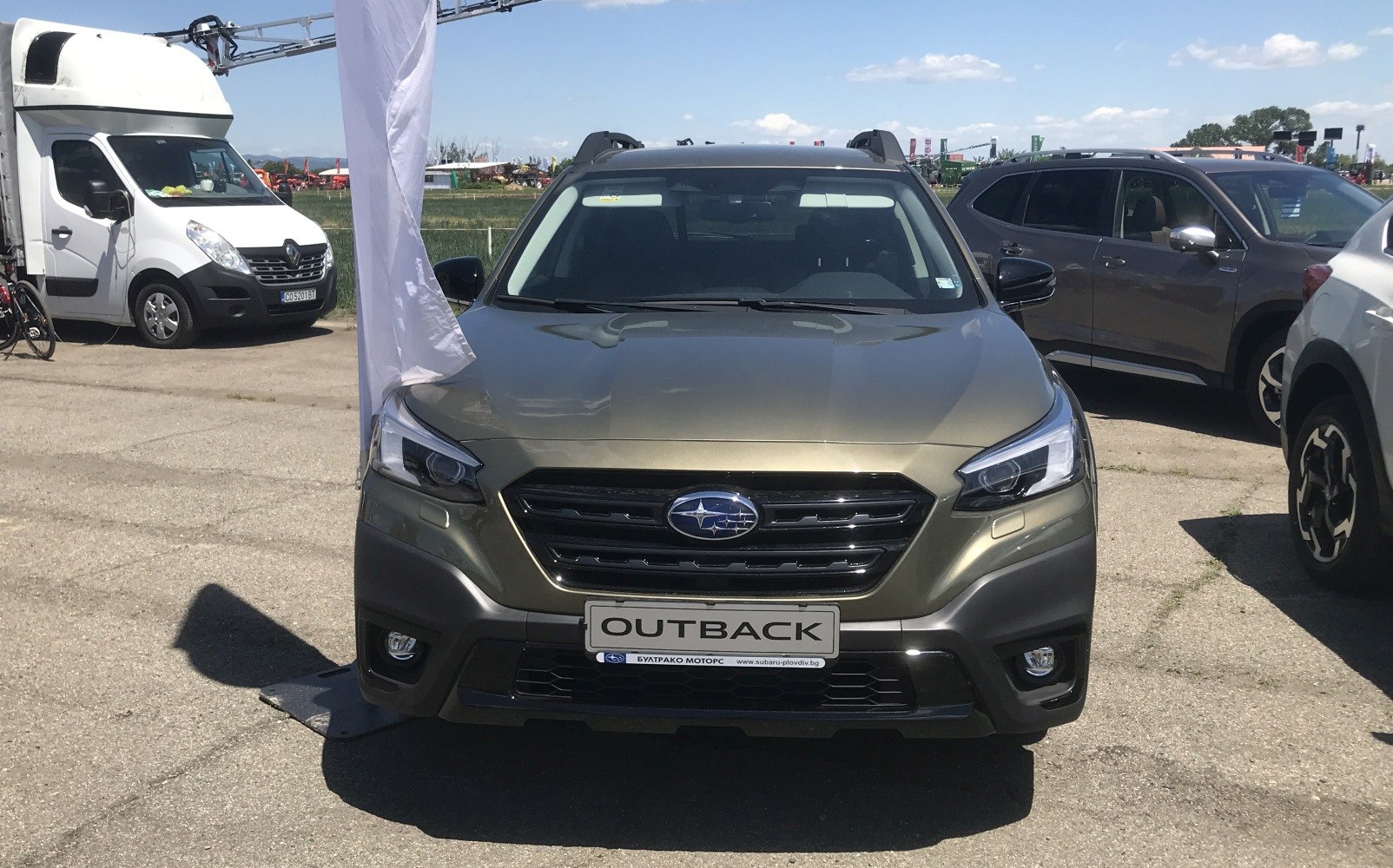 SUV front view with LED headlights and black grille in daylight