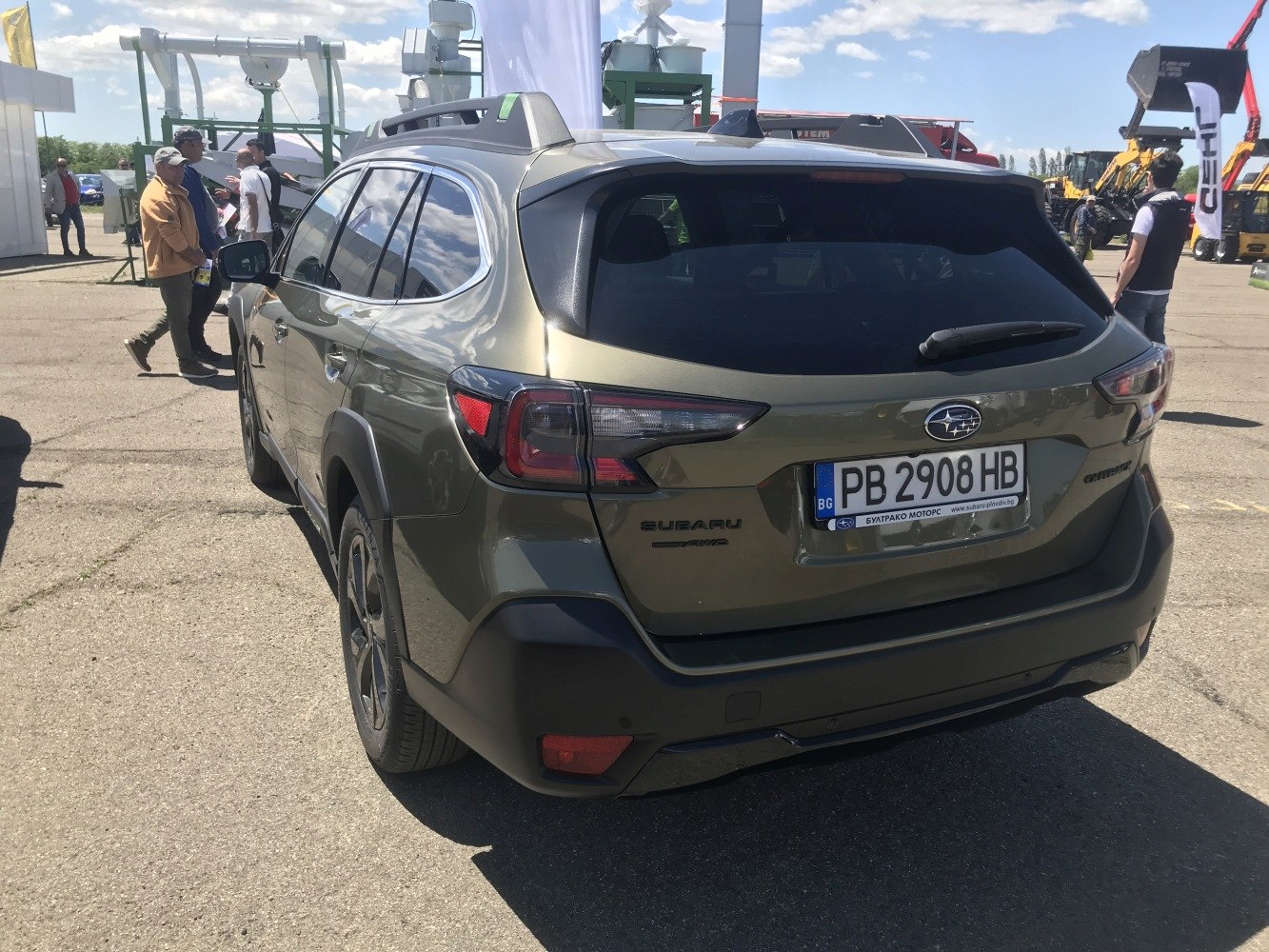 Rear view with unique taillights and roof rails of a modern crossover SUV